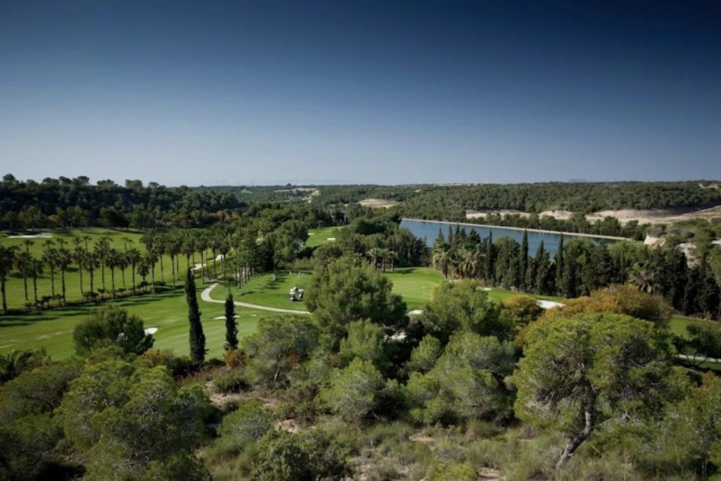 Mature fairways and reservoir at Real Club de Golf Campoamor