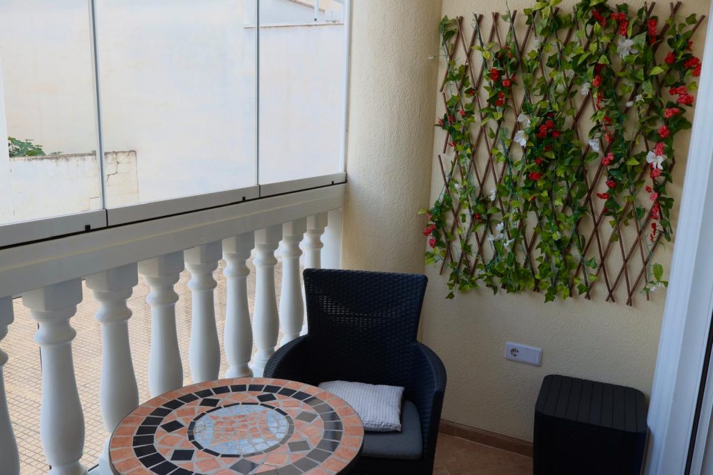 Private balcony with table and seating