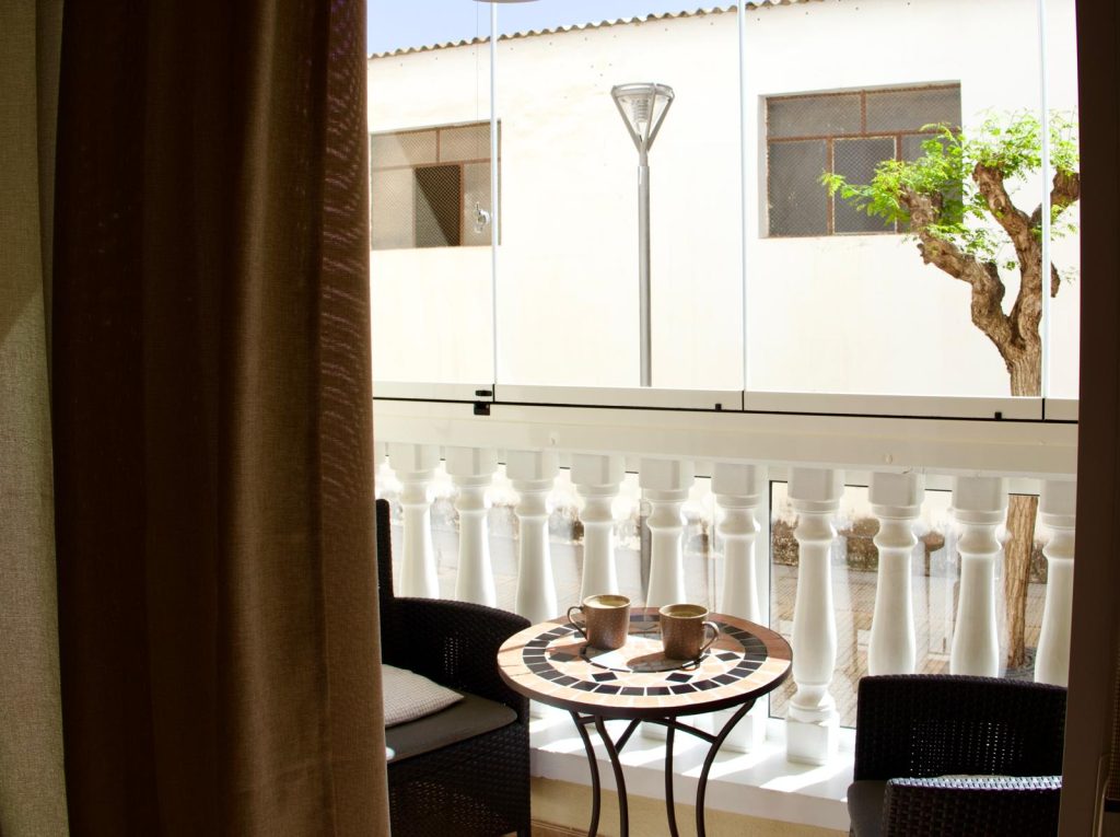 Balcony with coffee table and chairs