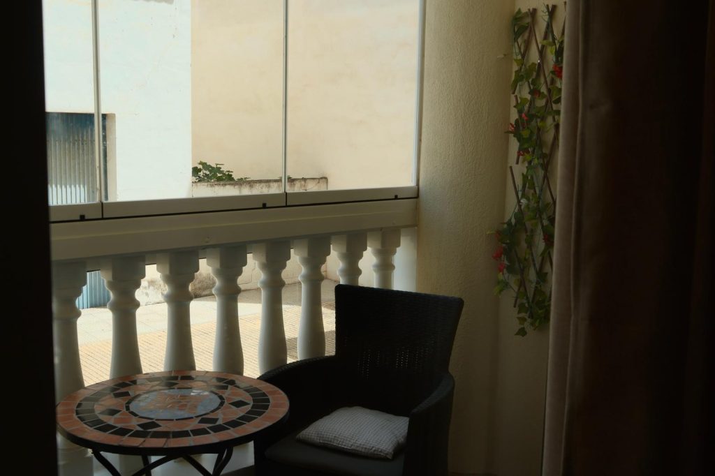 Balcony seating area with mosaic table