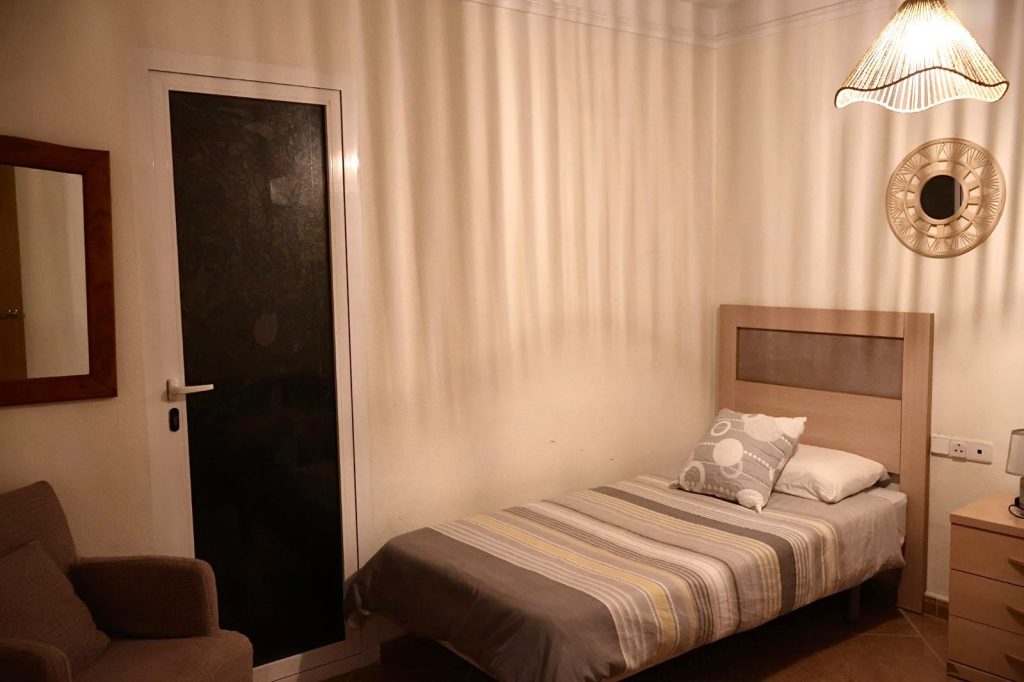 Single bedroom with armchair