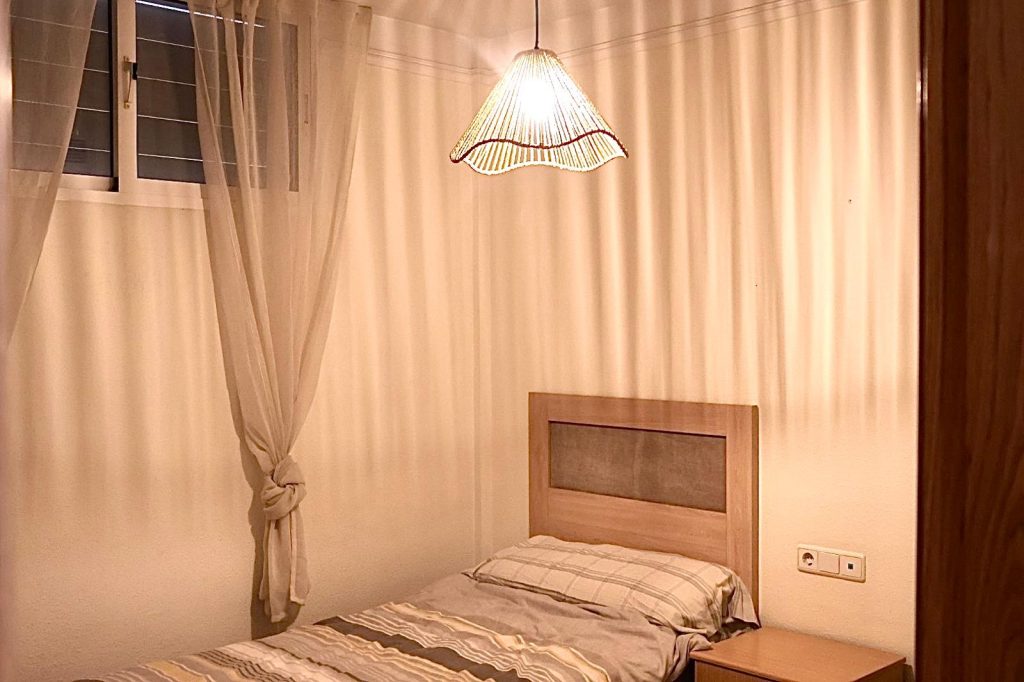 Bedroom with window and bedside table