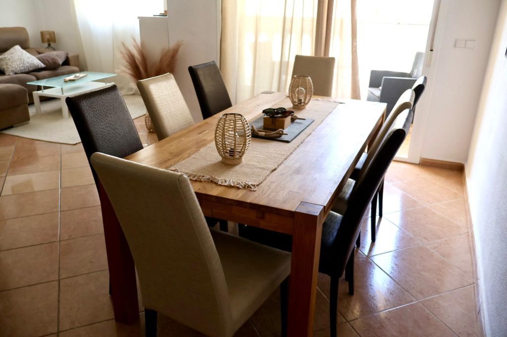 Dining table with lounge area beyond
