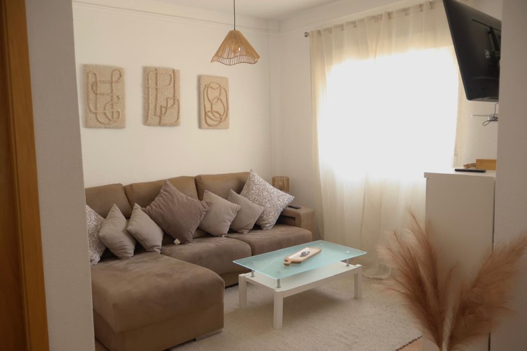 Living room with large corner sofa and television